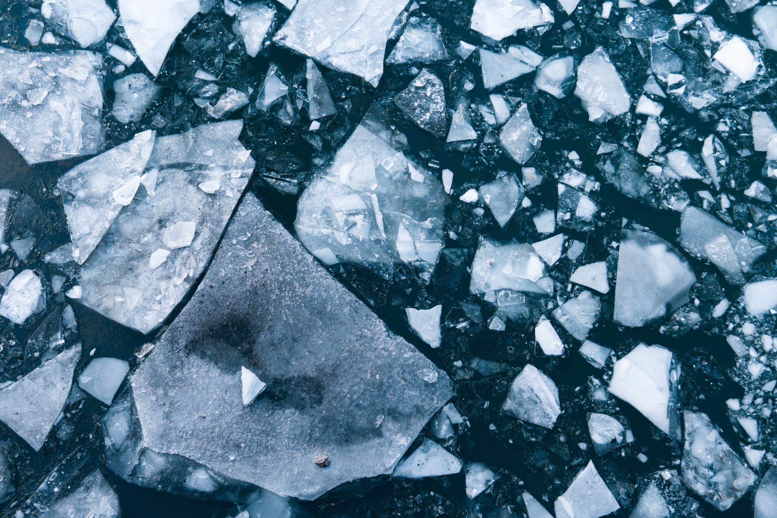 The broken shards of ice in dark water is a metaphor for keeping our well being intact during the coming holiday